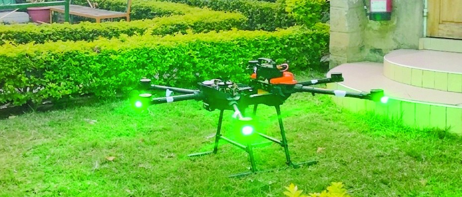 Precision agricultural drone operating over cultivated land