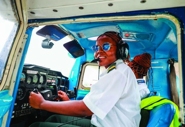 A pilot at the controls of a training aircraft